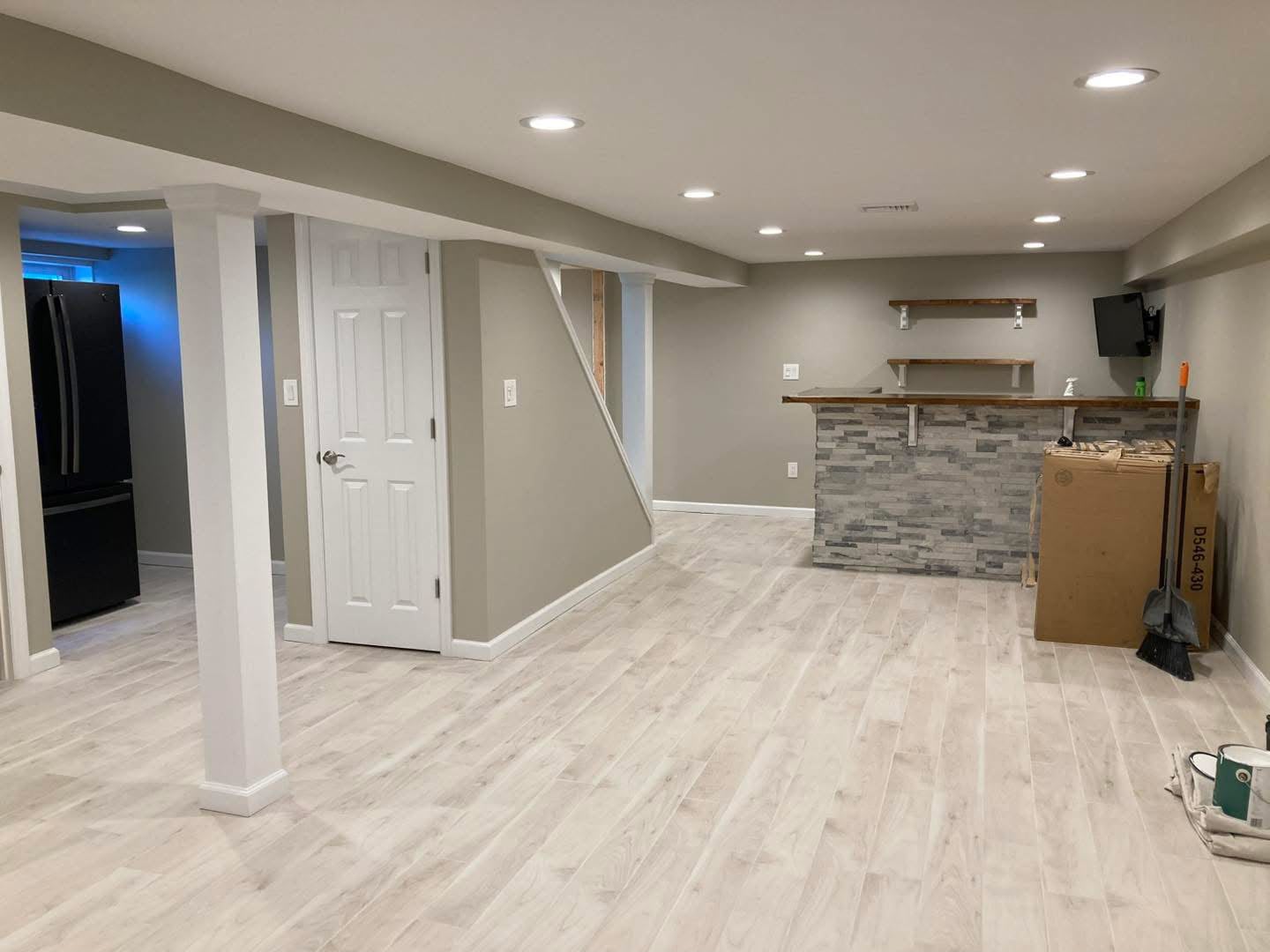 Finished basement with stone bar and columns