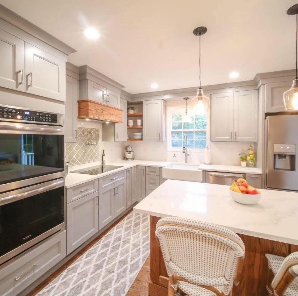 Gray farmhouse-style kitchen with wood island